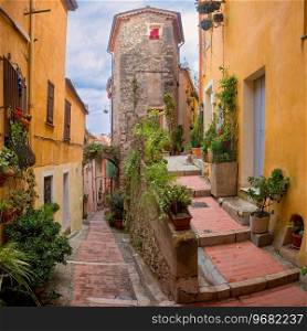 Colorful cosy street and houses in the Old Town of Menton, French Riviera, France. Menton, French Riviera, France