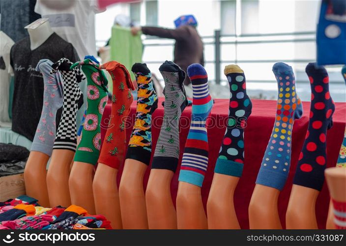 Colorful cotton and wool socks hanging for sale at the bazaar