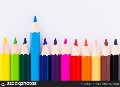 Colorful crayons arranged on a white background.