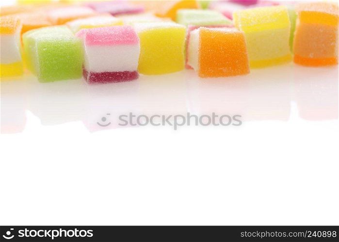Colorful cube jelly candy isolated in white background