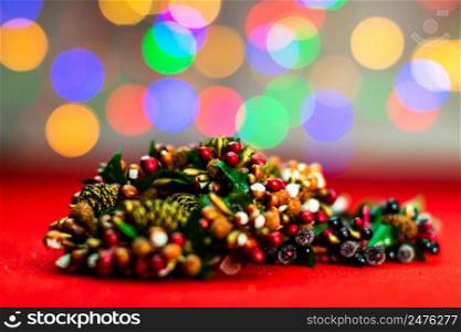 Colorful decorated Christmas wreaths isolated on background of blurred lights.
