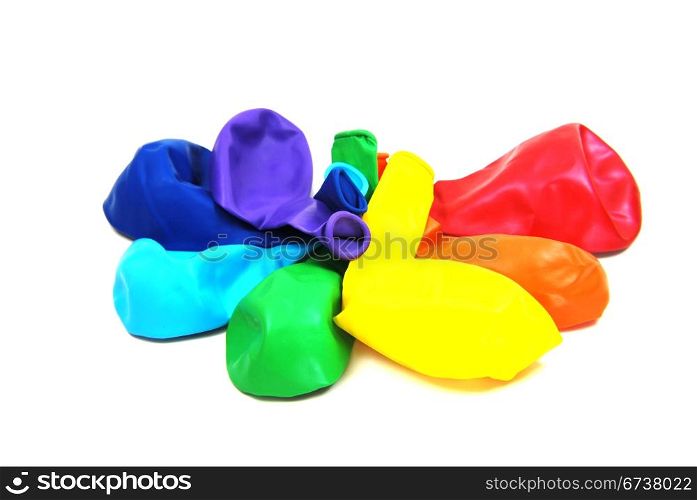 Colorful deflated balloons isolated on white background