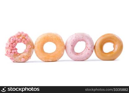 Colorful delicious donut in a row. Isolated on white background.