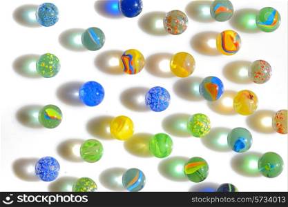 Colorful different Marbles on white background
