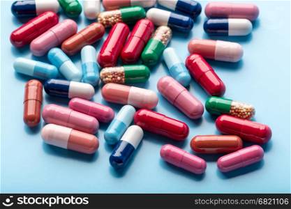 Colorful different medicine capsules. Colorful different medicine capsules on blue background