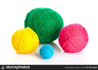 colorful different thread balls. wool knitting on white background