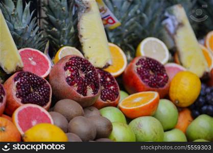 Colorful display of fruits background on traditional local market ready to made fresh juice drink