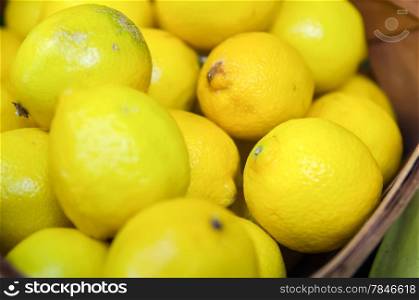 Colorful Display Of Lemons In Market in a basket