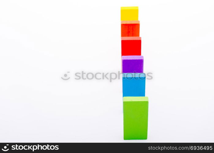 Colorful Domino Blocks in a line on a white background