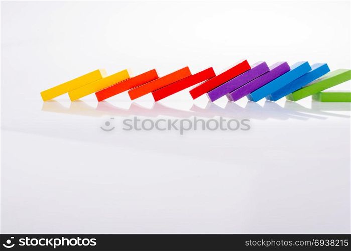 Colorful Domino Blocks in a line on a white background