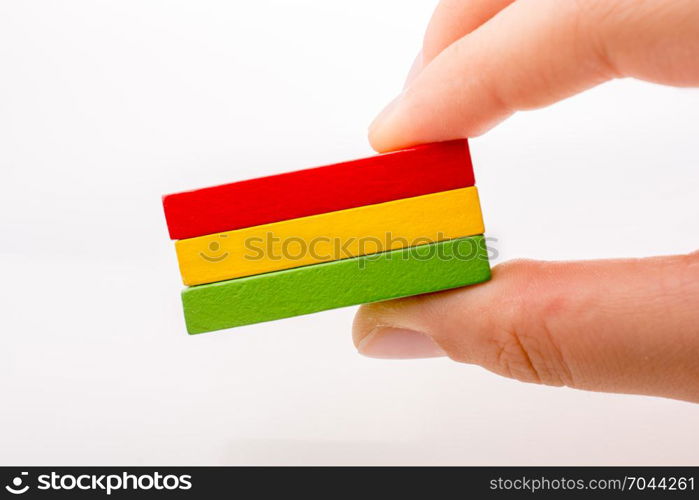 Colorful Domino Blocks in a line on a white background