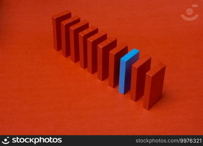 Colorful dominoes. Rainbow colored chain reaction.