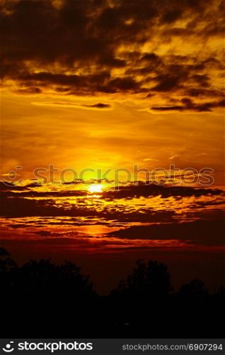 colorful dramatic sky with cloud at sunset. Golden sky background