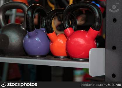Colorful Dumbbells in Gym: Weight Fitness Equipment