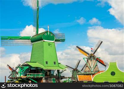 Colorful Dutch Windmills at the river Zaan, Zaanse Schans, Zaandam, The Netherlands
