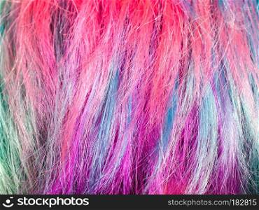 colorful dyed strands of female hairs close up