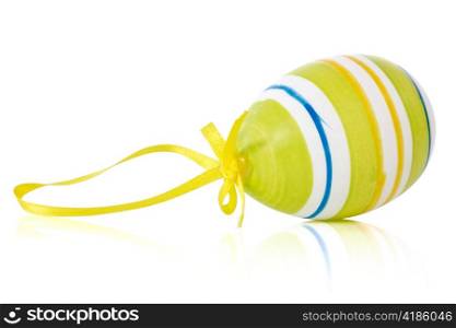colorful easter egg with reflection on white background