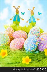 Colorful Easter eggs, beautiful painted eggs on the grass, diversity of traditional decorations for Christian spring holiday