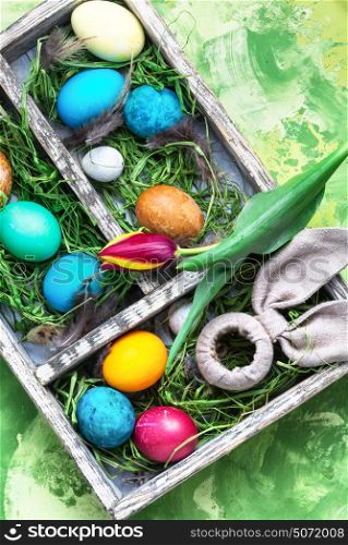 Colorful Easter eggs. Easter colored egg and a symbolic rabbit in box