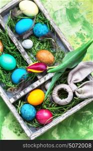 Colorful Easter eggs. Easter colored egg and a symbolic rabbit in box