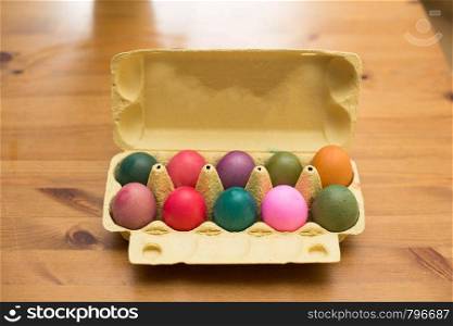 Colorful Easter eggs in box on a table, easter decoration april. Colorful Easter eggs in box on a table, easter decoration