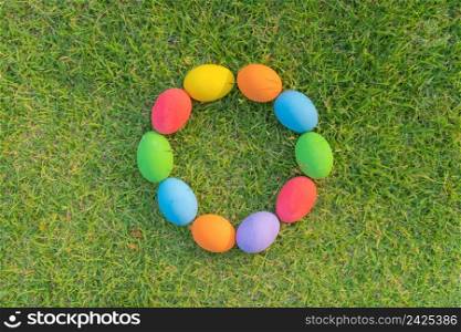 Colorful easter eggs on natural green grass background. Food decoration on holiday.