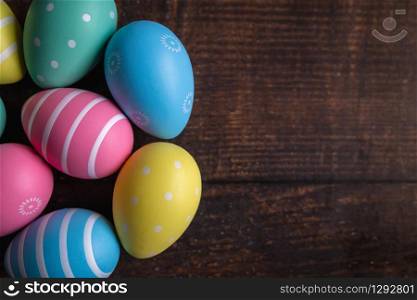 Colorful Easter eggs on old wooden background. Colorful Easter eggs