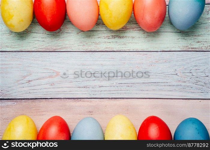 Colorful easter eggs on pastel background with copy space. Top view mock up. Colorful easter eggs on pastel background