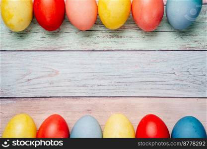 Colorful easter eggs on pastel background with copy space. Top view mock up. Colorful easter eggs on pastel background