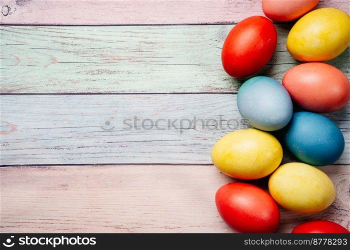 Colorful easter eggs on pastel background with copy space. Top view mock up. Colorful easter eggs on pink background