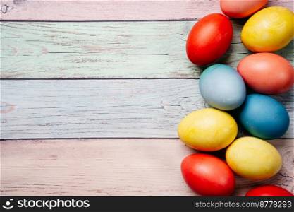 Colorful easter eggs on pastel background with copy space. Top view mock up. Colorful easter eggs on pink background