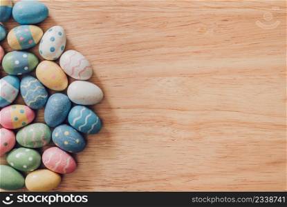 Colorful easter eggs on wooden table background vintage with copy space.