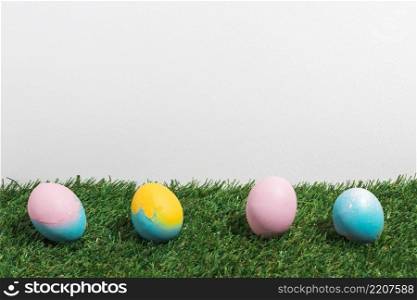 colorful easter eggs scattered grass