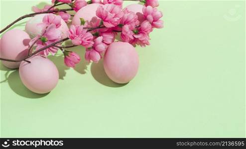 colorful easter eggs with flowers green table
