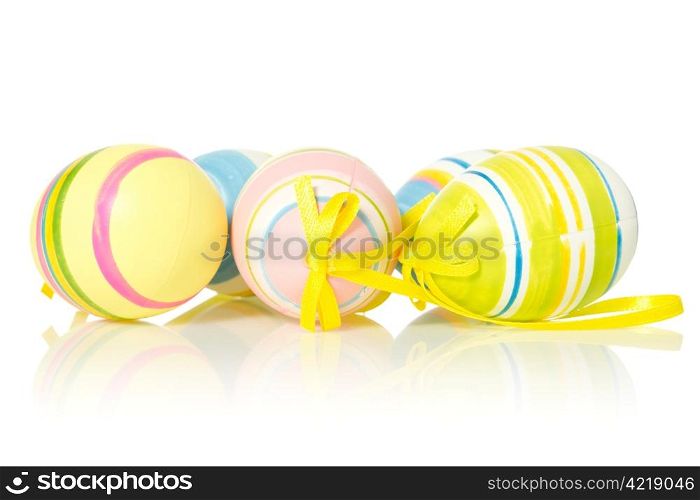 colorful easter eggs with reflection on white background