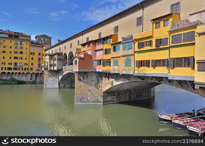 colorful facade on a bridge- famous ponte vecchio in Florence, Italy above Arno river