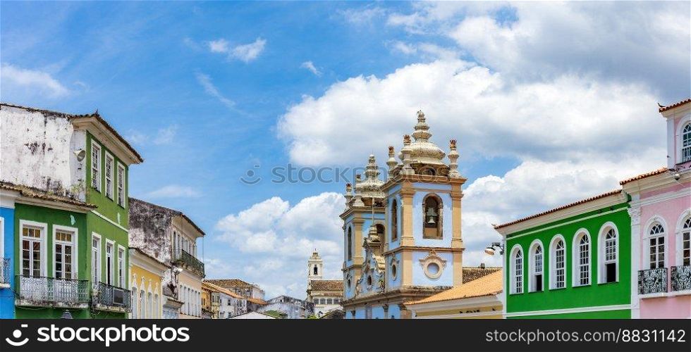 Colorful facades of houses and historic church in Pelourinho in Salvador on a sunny day. Colorful facades of houses and church in Pelourinho