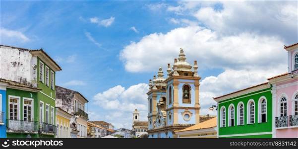 Colorful facades of houses and historic church in Pelourinho in Salvador on a sunny day. Colorful facades of houses and church in Pelourinho