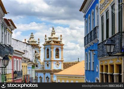 Colorful facades of old houses and historic church in Pelourinho neighborhood in Salvador city, Bahia. Colorful facades of old houses and church in Pelourinho, Salvador