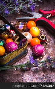 Colorful fashion beads. Beads for making jewelry in a tin retro box