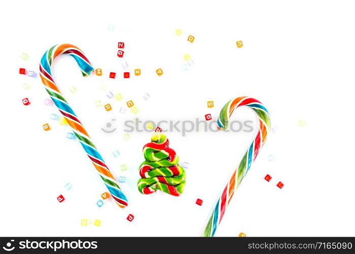 Colorful festive Lollipops and candy in fir form on white background selective focus.. Colorful festive Lollipops and candy in fir form on white background selective focus