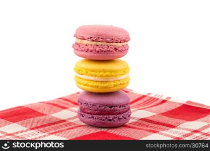 Colorful few macaroons over a white background