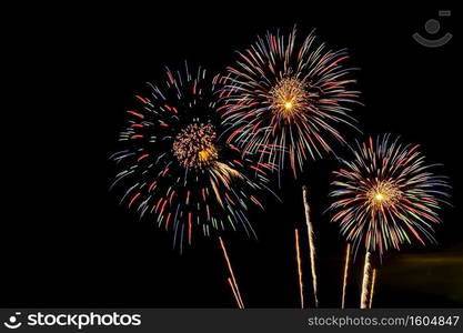 Colorful Firework display background at night for celebration anniversary