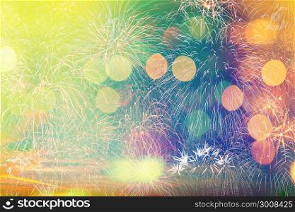 Colorful fireworks with bokeh light blurred for abstract holiday background.