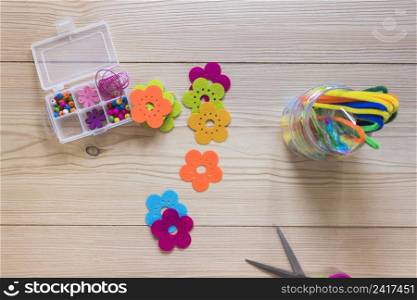 colorful flower patch chenille stems beads box wooden backdrop