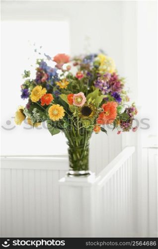 Colorful flowers arranged in vase.