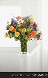 Colorful flowers arranged in vase.