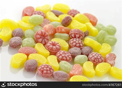 colorful fruit flavored candies assortment on a white background