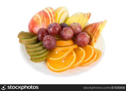 Colorful fruit salad with orange, kiwi, grapes and apple