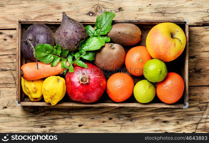 Colorful fruits and vegetables. Box with apple, tangerine, lime and pomegranate.Dieting,detox and vegetarian